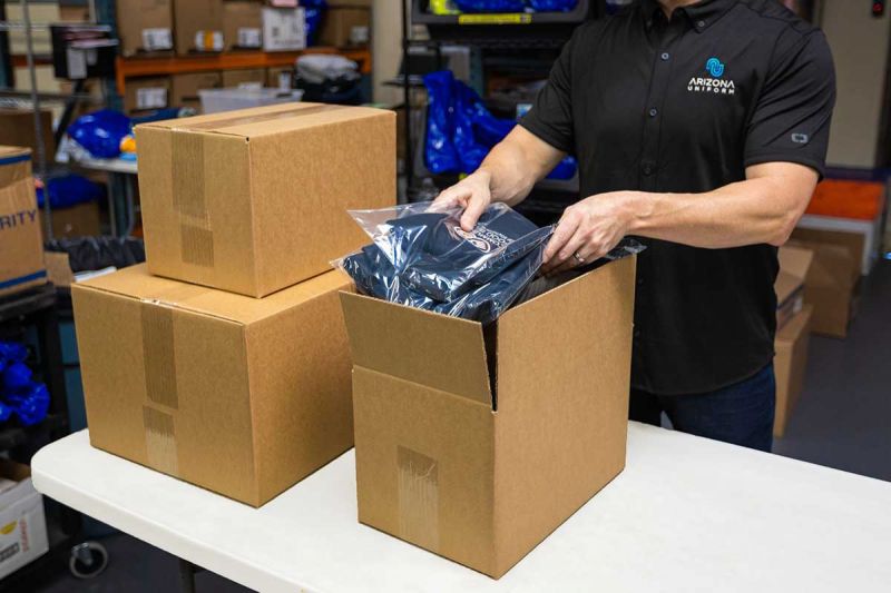 Arizona Uniform employee packaging shirts