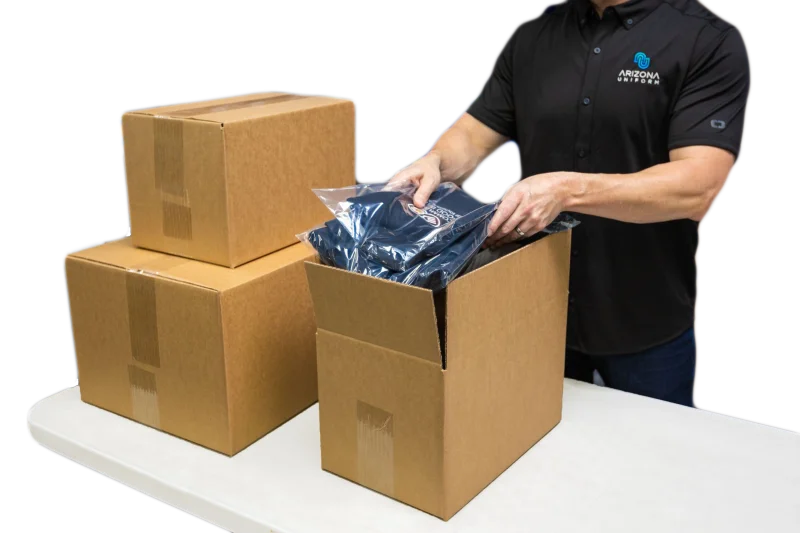 Worker packing AZ Uniform shirts