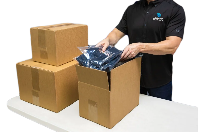 Worker packing AZ Uniform shirts
